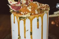 09 decadent frosted wedding cake with salted caramel drip, gold leaf, figs and dried fruit