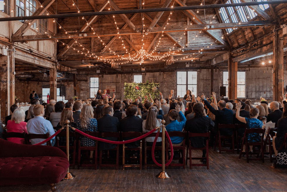 The venue was an old barn filled with lights and decorated with velvet furniture