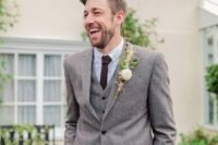 10 a grey tweed suit with a burgundy tie is a chic neutral idea