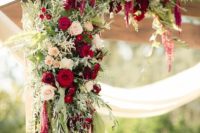 10 lush greenery, ivory and red roses weddign arch decor