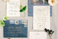 10 neutral calligraphy invites and blue envelopes with floral lining