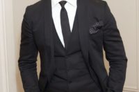 11 a black three piece suit with a black tie is a classic idea that will suit many themes and styles