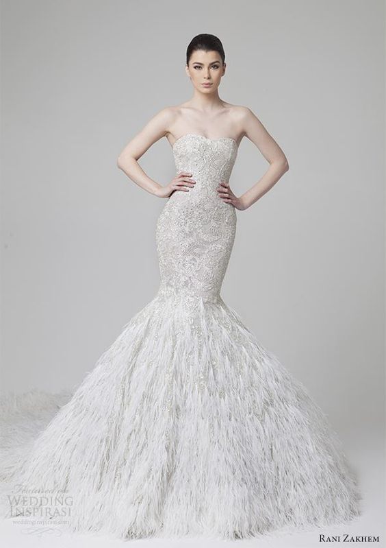 strapless sweetheart neckline lace and heavily embellished mermaid wedding dress with a feather skirt