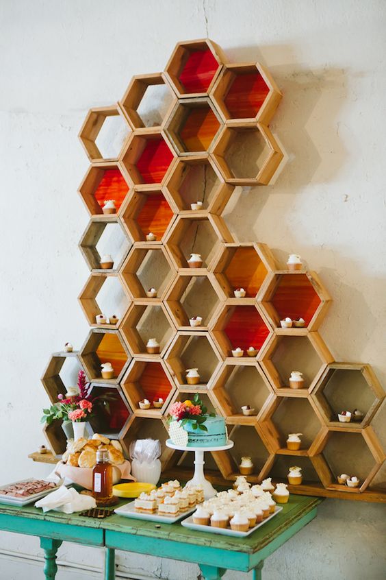 colorful hexagon dessert display with cupcakes looks unique