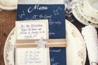 13 a navy and silver glitter menu and a star topper