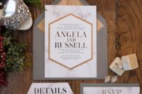 13 marble wedding invitations in grey and orange envelopes