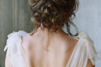 13 messy curly wedding updo with a gold and rhinestone hair vine