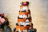 13 multi-layer drizzle wedding cake with caramel drip, blackberries, figs and topped with fresh blooms