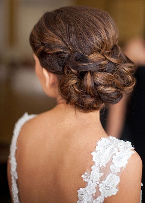 braided and twisted low updo with no accessories will fit lots of bridal styles