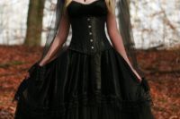 14 vintage corset wedding dress, a black veil with a lace edge and a statement necklace for a vintage-inspired bride