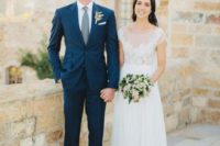 15 a navy single breast wedding suit with a white shirt, a green tie and copper shoes