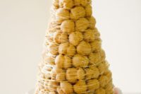 16 a traditional croquembouche with caramel cover is a spectacular alternative to a usual cake