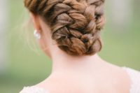 16 braided low bun hairstyle with a volume looks very unusual and non-traditional