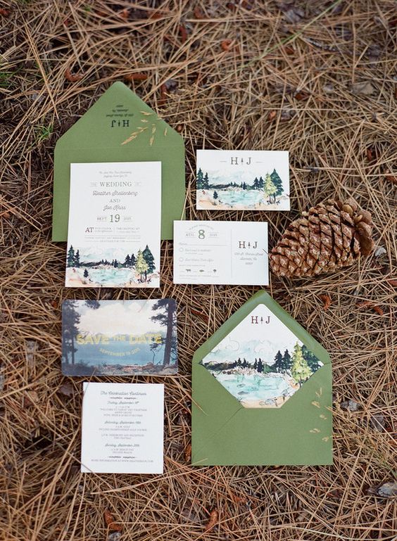 green envelopes with woodland print lining and landscape print invites