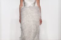 a strapless draped satin bodice wedding dress with a fluffy feather skirt is a modern glam solution for a fashionable bride