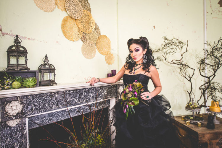 strapless black ballgown with a beaded bodice and a ruffled tulle skirt for a Halloween bride