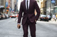 18 burgundy wedding suit with a white shirt and a thin black tie