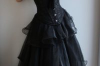 18 strapless corset wedding dress with a velvet bow and a ruffled skirt for a steampunk bride