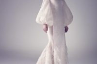 an off the shoulder wedding dress with bell sleeves and a feathered skirt is a dreamy and chic ideafor a winter bride