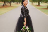 20 strapless sequin bodice wedding dress with a full tulle skirt and a black leather jacket looks wow