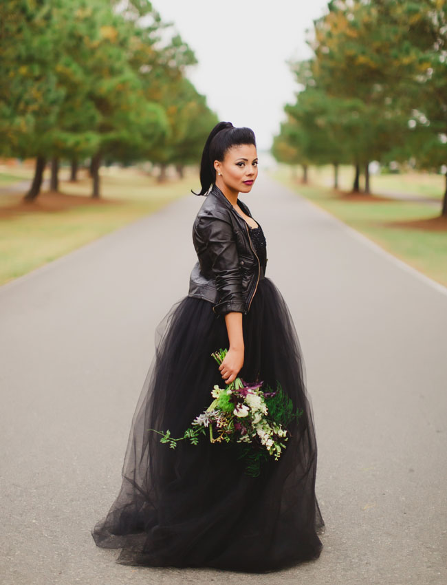 strapless sequin bodice wedding dress with a full tulle skirt and a black leather jacket looks wow