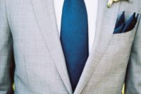 21 a light grey wedding suit with a wide blue tie and a white shirt looks fresh