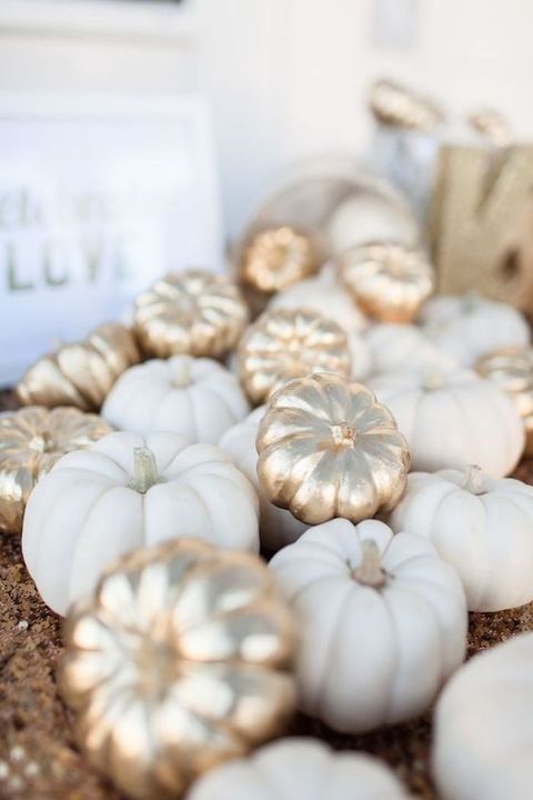 gilded faux pumpkins mixed with white ones for wedding decor