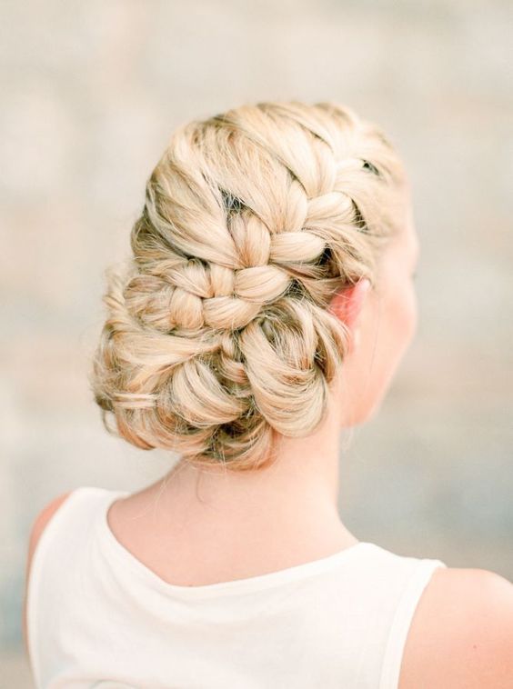 large side braided updo with twisted parts and no accessories is a safe idea that will last long