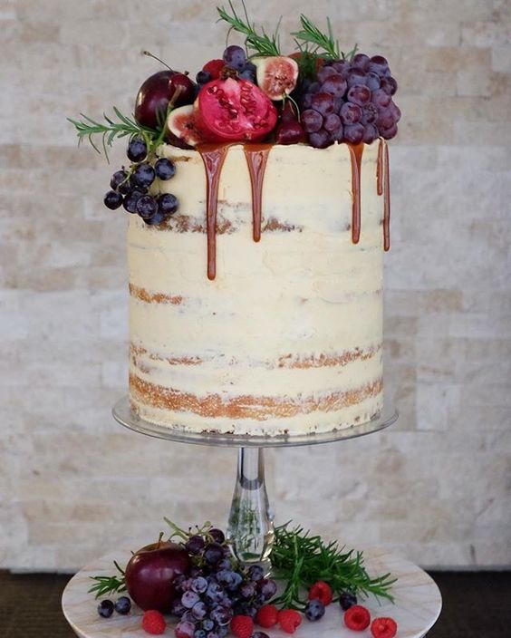 semi naked cake with grapes, pomegranates, figs and chocolate drip