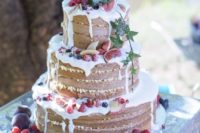 22 rustic naked wedding cake with white chocolate drip, figs, raspberries, blueberries
