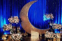 22 the moon and stars wedding ceremony space with candles and blush florals