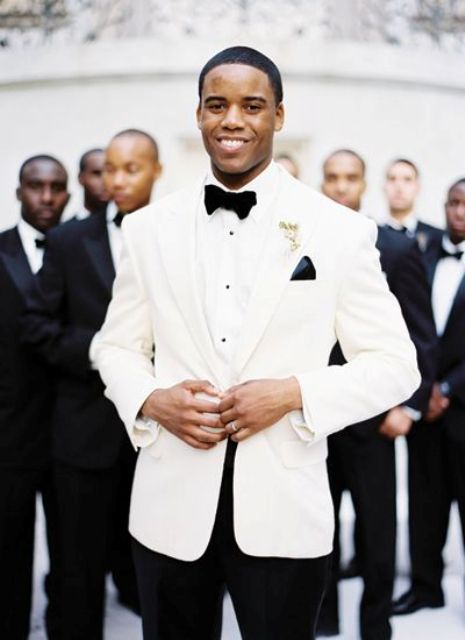 a dapper groom in a white dinner jacket for a chic and elegant look