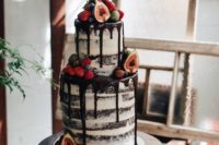 24 semi naked chocolate wedidng cake with chocolate drip, figs, raspberries and strawberries