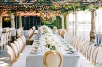 26 an elegant fall garden reception in dove grey and cream, with leaves and lights above