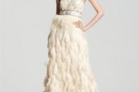 a strapless wedding dress with a crystal and beaded bodice and a feather skirt will be a fresh idea for a glam wedding