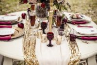 27 gold sequin table runner layered with a cream one and with a burgundy bow