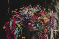 28 lush floral centerpiece with berries, leaves and greenery