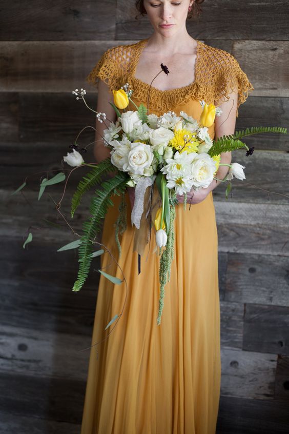 mustard wedding dress with a crochet top and sleeves