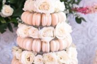 30 blush macaron wedding tower served with fresh white roses