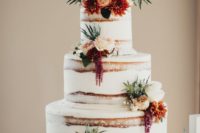 32 semi naked wedding cake with burgundy and orange flowers