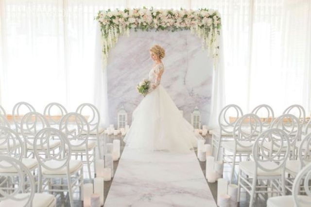 pink marble wedding backdrop, aisle runner and floral decor