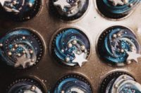 39 starry cupcakes in navy and bold blue with edible decor