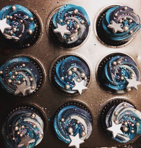 starry cupcakes in navy and bold blue with edible decor