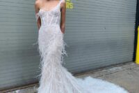 a jaw-droppingly sexy feather mermaid wedding dress with thick straps and a train is a gorgeous solution for a modern bride