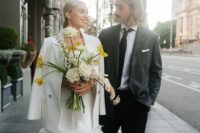 a modern bridal look with a plain feather over the knee wedding dress, a matching blazer and black shoes for a city hall wedding