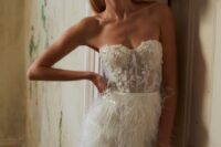 a refined strapless wedding dress with an embellished lace applique bodice and a feather skirt is a lovely idea for a wedding reception