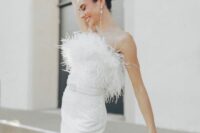 a strapless embellished fitting midi wedding dress with a belt and pearl earrings is a fantastic idea for a glam wedding