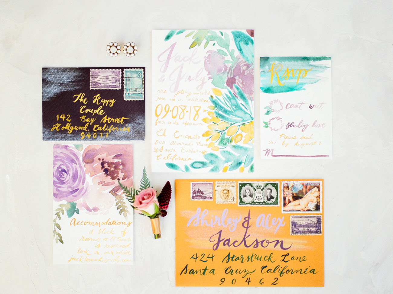 The colorful wedding invitation suite was done with watercolor florals