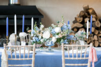 02 The wedding tablescape was done in powder blue, with creamy and peachy shades and lots of candles, pay attention to a gorgeous floral centerpiece