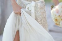 02 a wide strap wedding dress with a deep V cut, a sash and silver sequin detailing for a beach bride